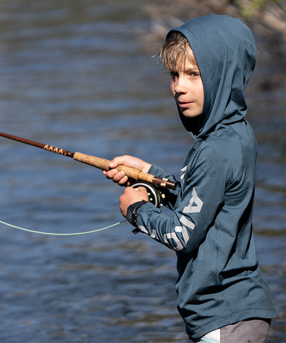 Kid fishing in AKOVA UPF 50+ sun hoodie