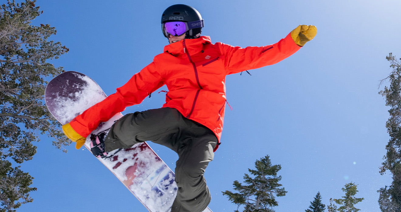 woman snowboarding shell
